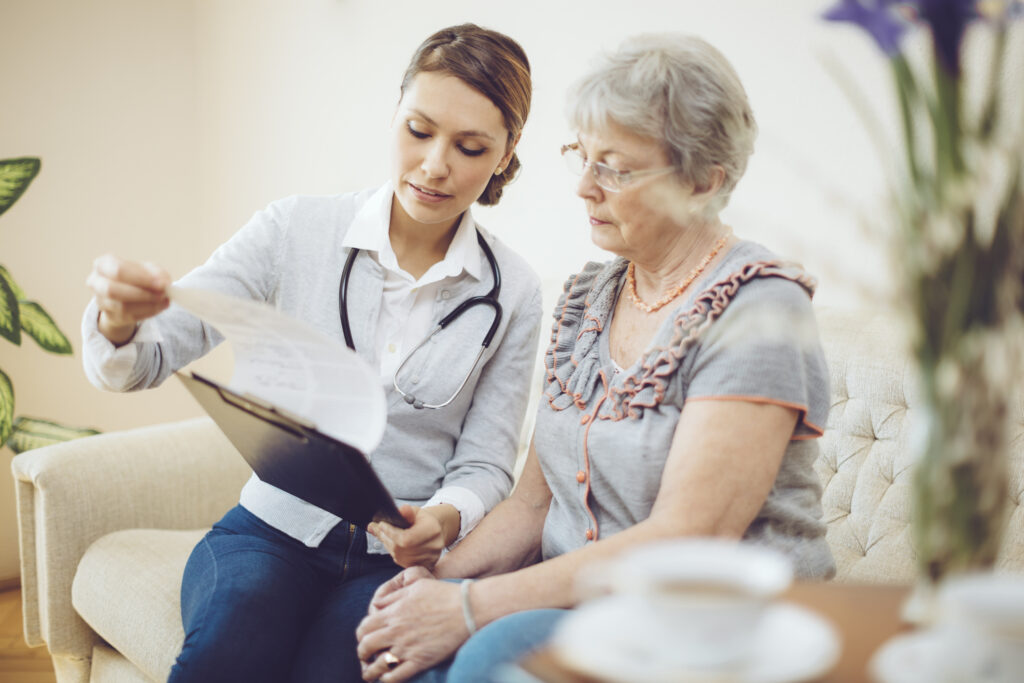 Female Doctor Consulting with Senior Patient
