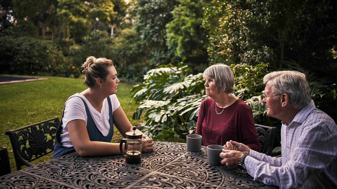 Daughter Speaking with her Parents