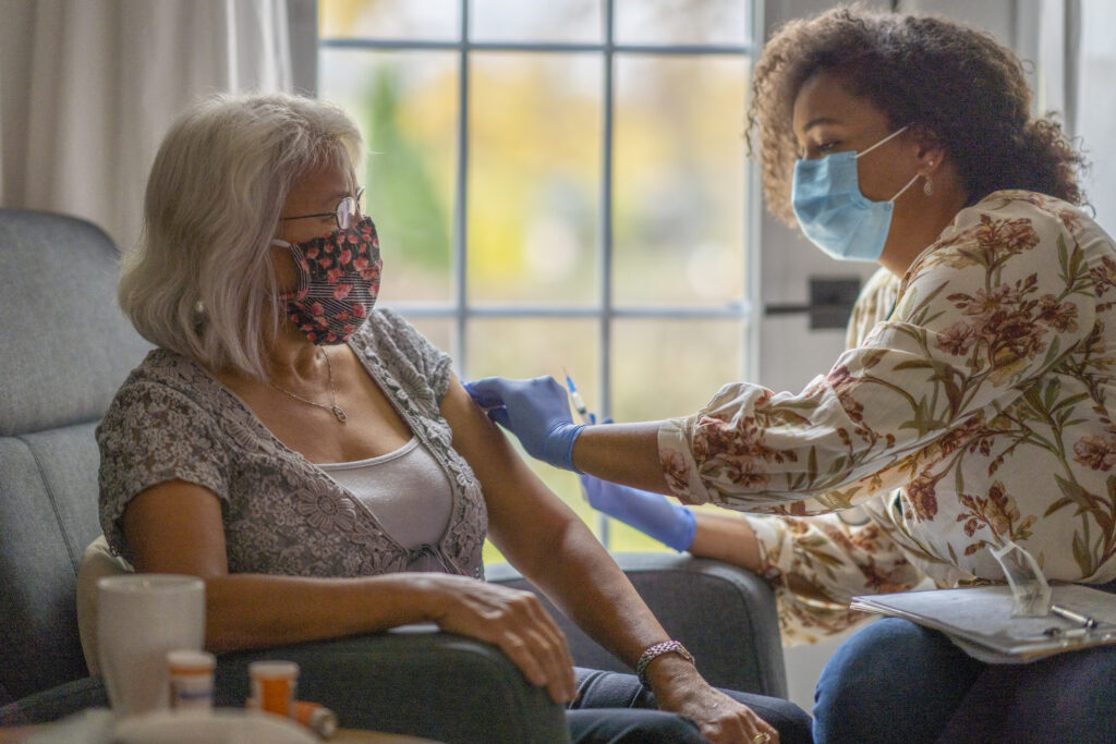 Senior Woman Getting a Vaccine From her Doctor