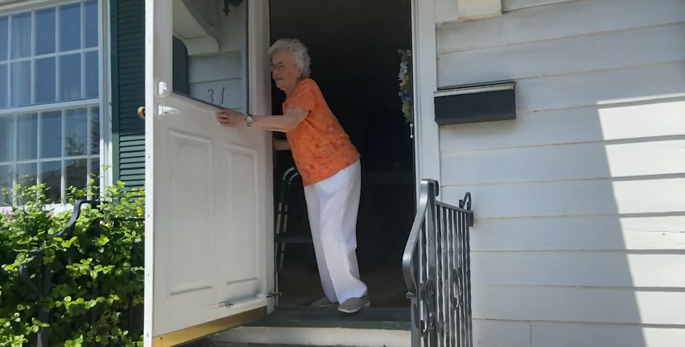 Patient holding a door