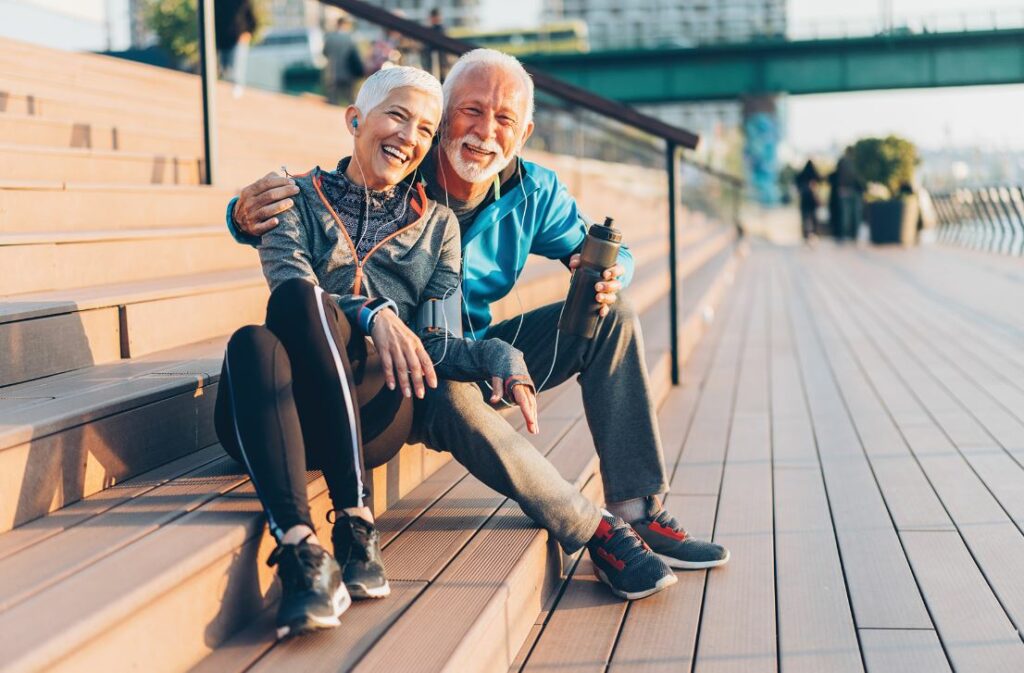 Elderly couple sitting on steps