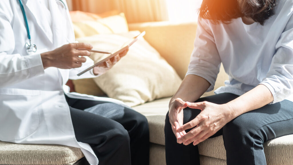 Woman speaking with her physician