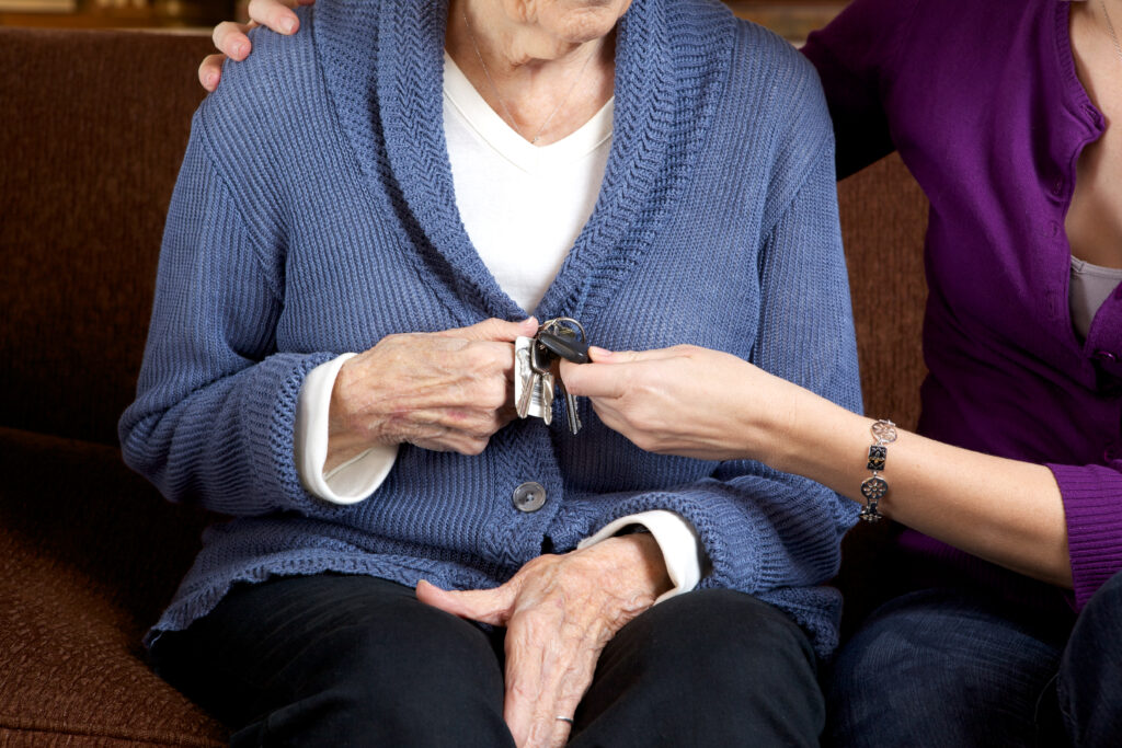 Senior woman holding car keys