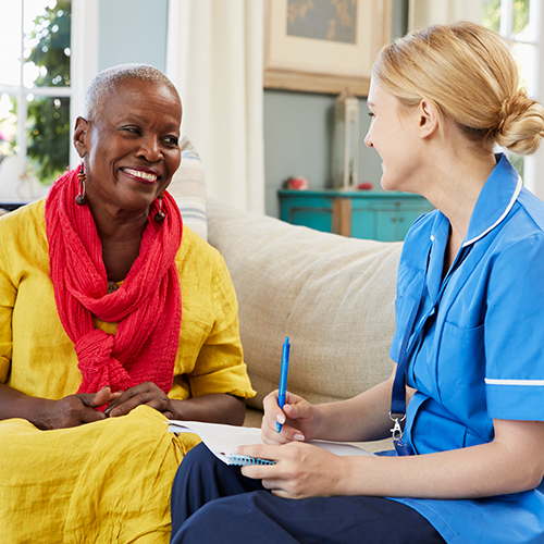 Doctor with patient in home